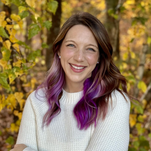Melissa Pielech, Ph.D. smiling headshot with autumn colors